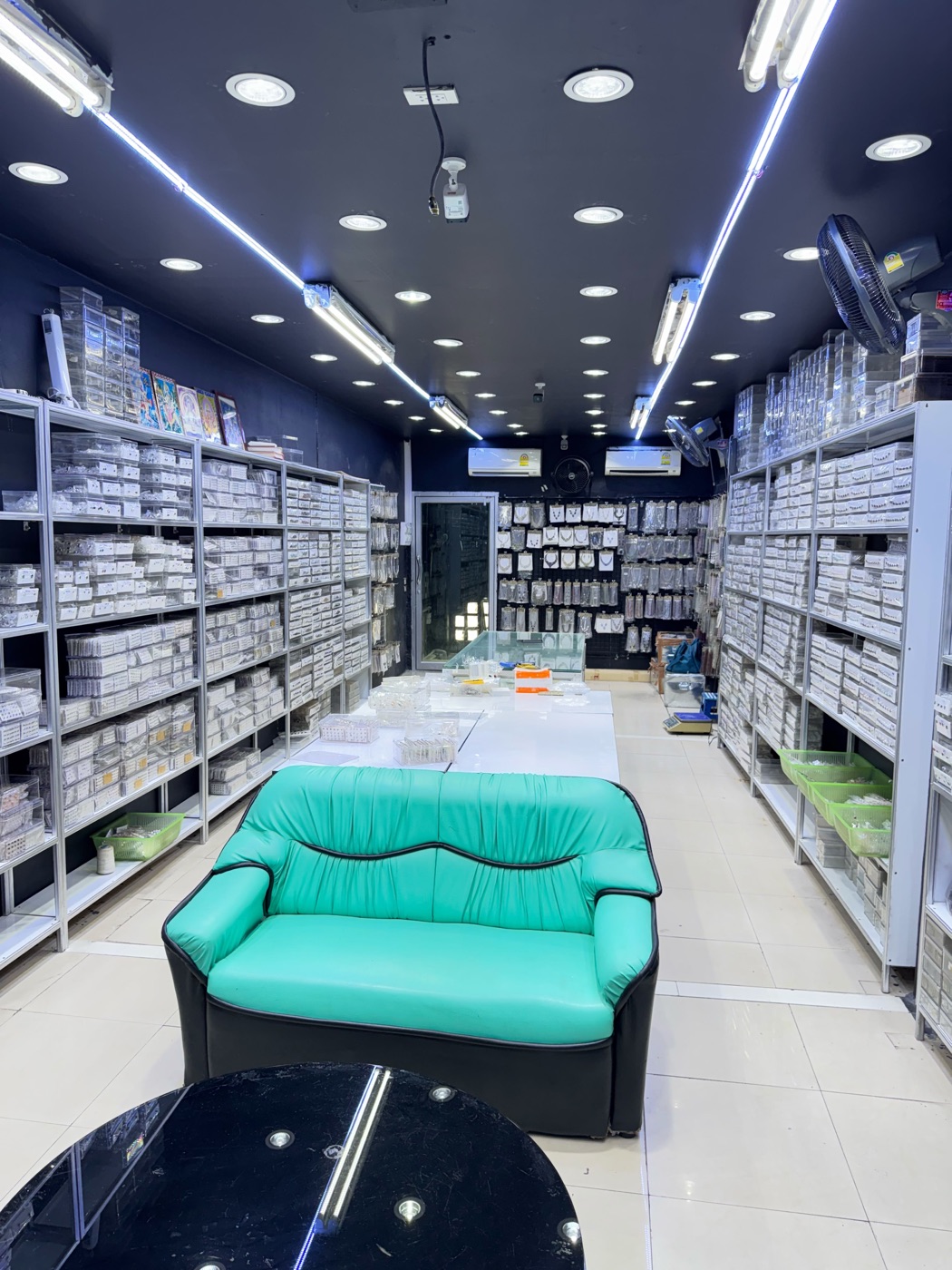 Showroom seating area surrounded by silver jewellery stock